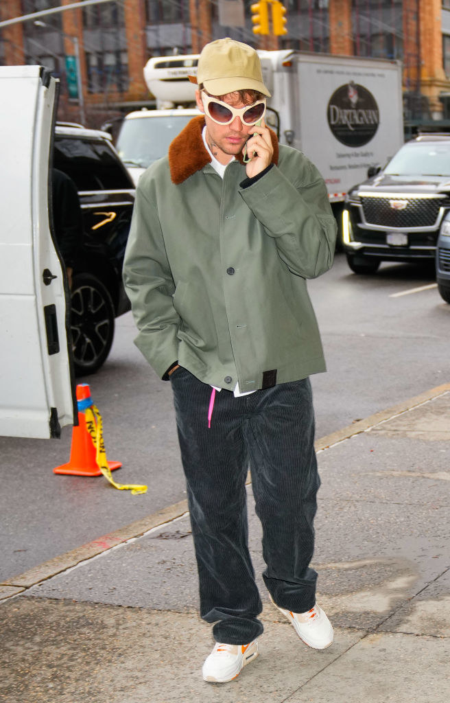 justin on the phone outside