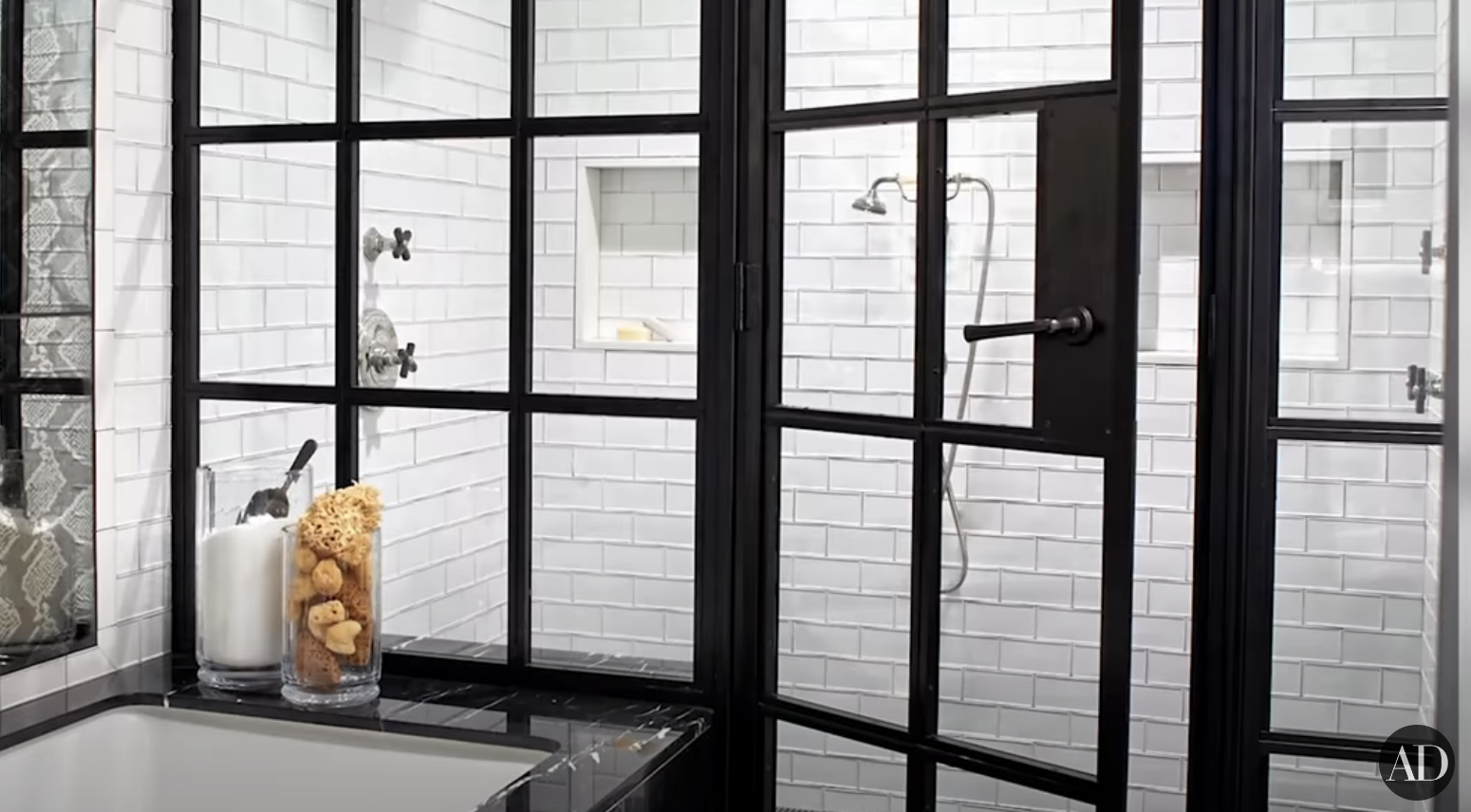 A bathtub with glass doors