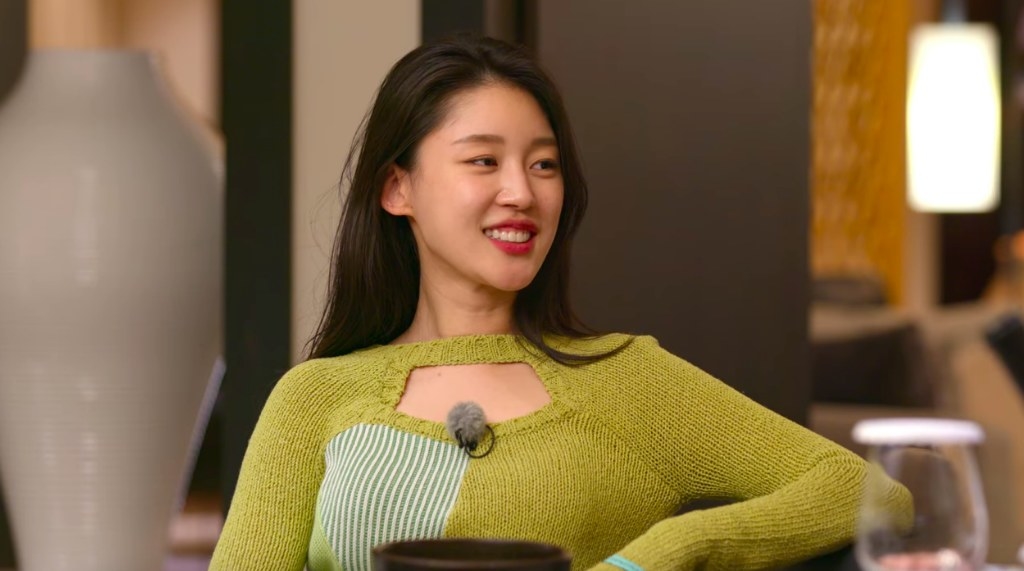 Choi Seo-eun smiles at her Paradise date in a green dress