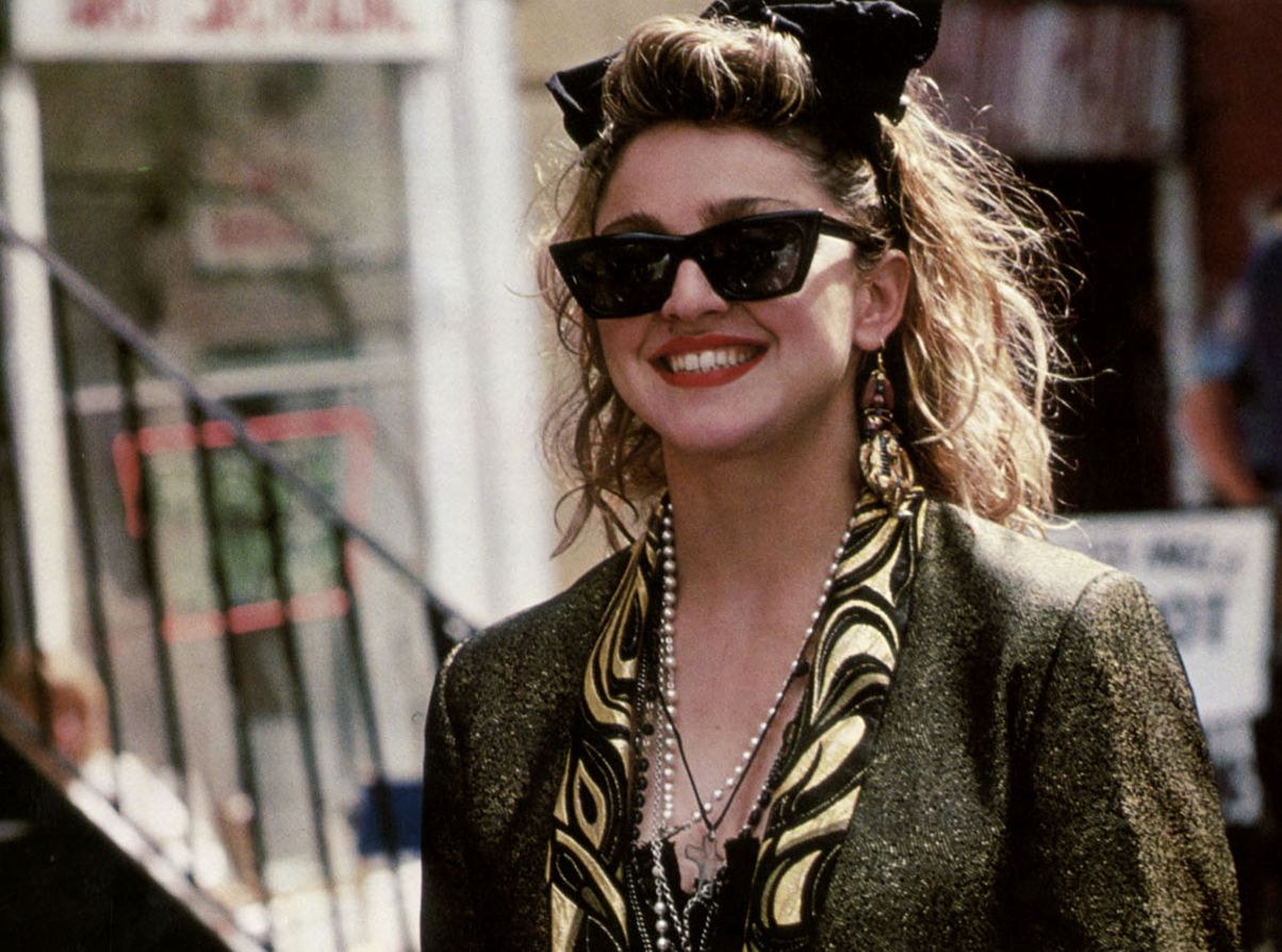 madonna smiling in eighties clothes