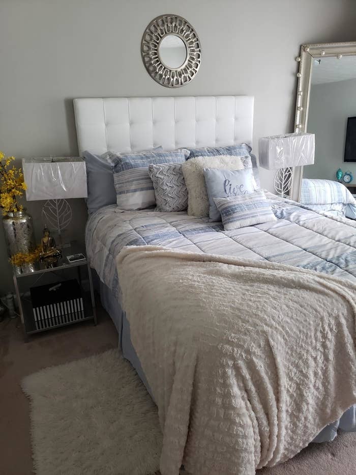 Reviewer&#x27;s white tufted headboard is shown in a bedroom