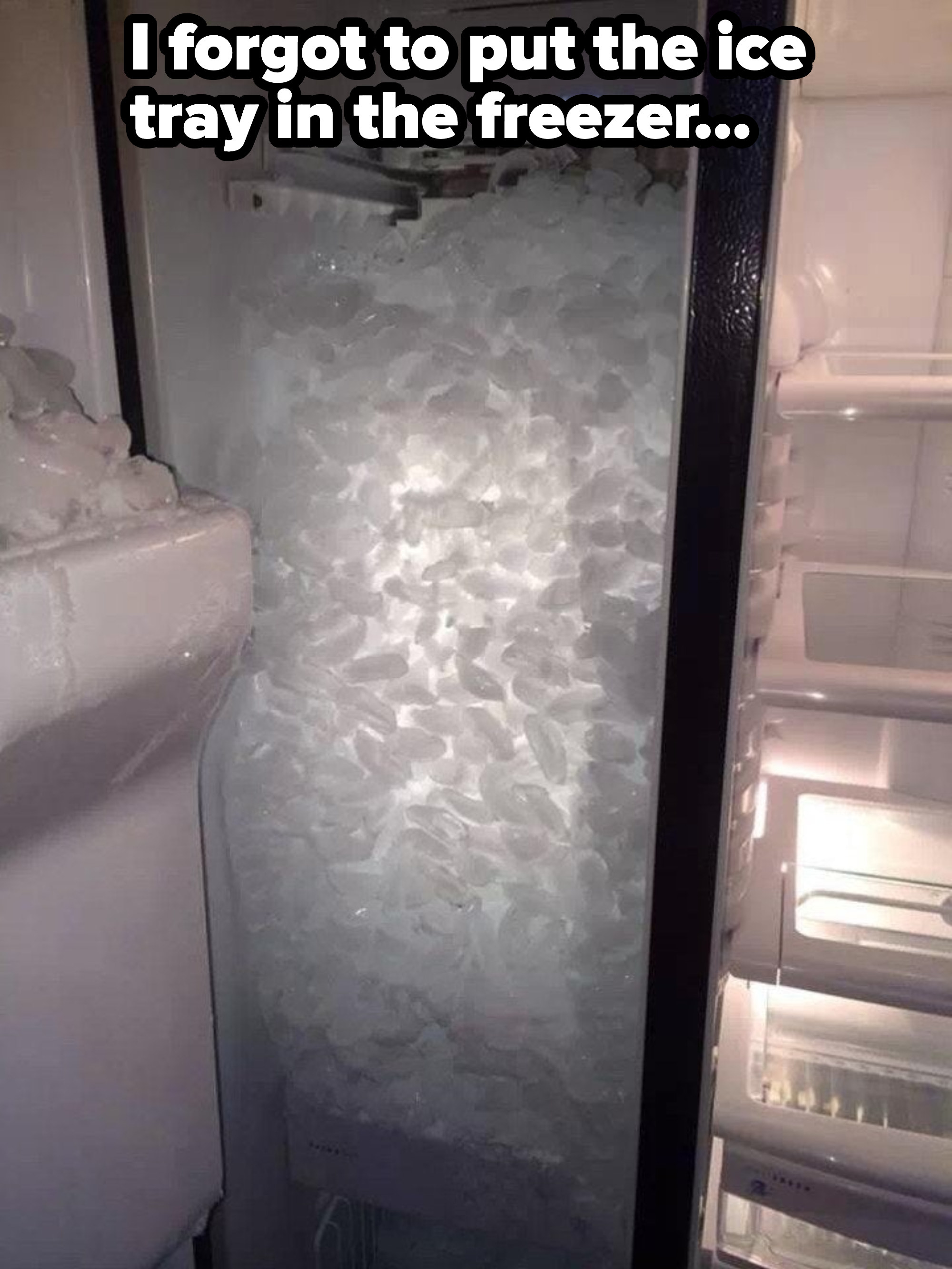 An ice-maker with ice up to the top, with caption &quot;I forgot to put the ice tray in the freezer&quot;