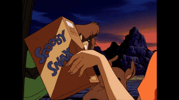 Shaggy and Scooby excitedly looking at a box of Scooby Snacks.