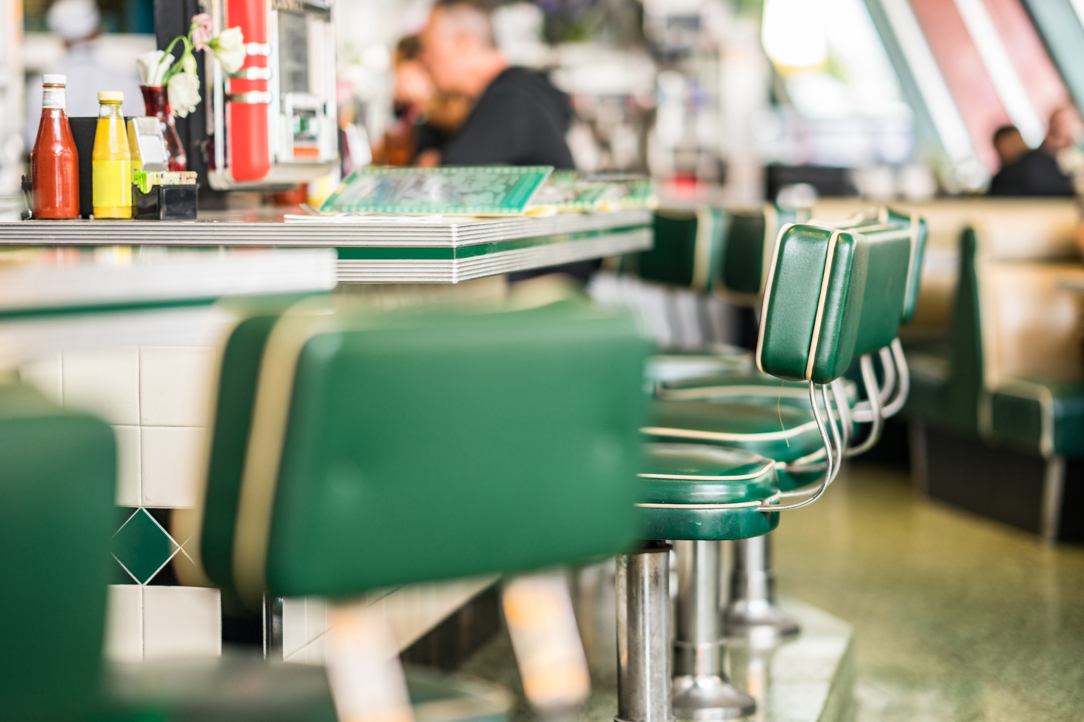 Vintage padded bar stools in an American diner.