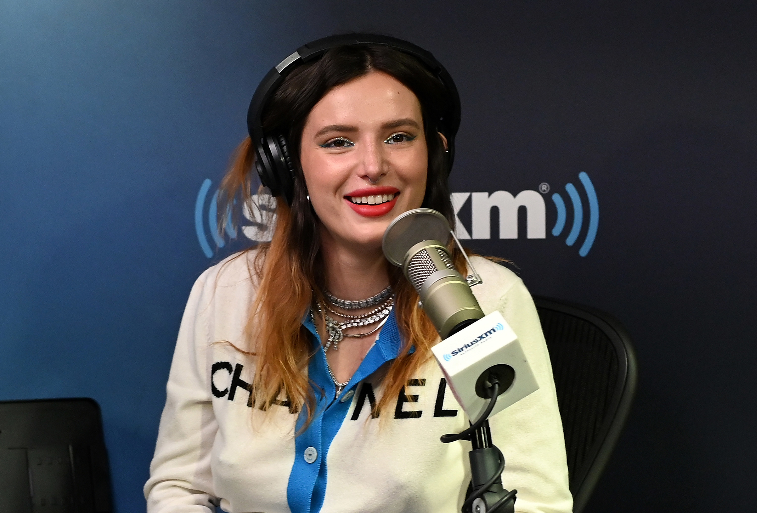 Bella smiles during a sit-down interview for Sirius XM