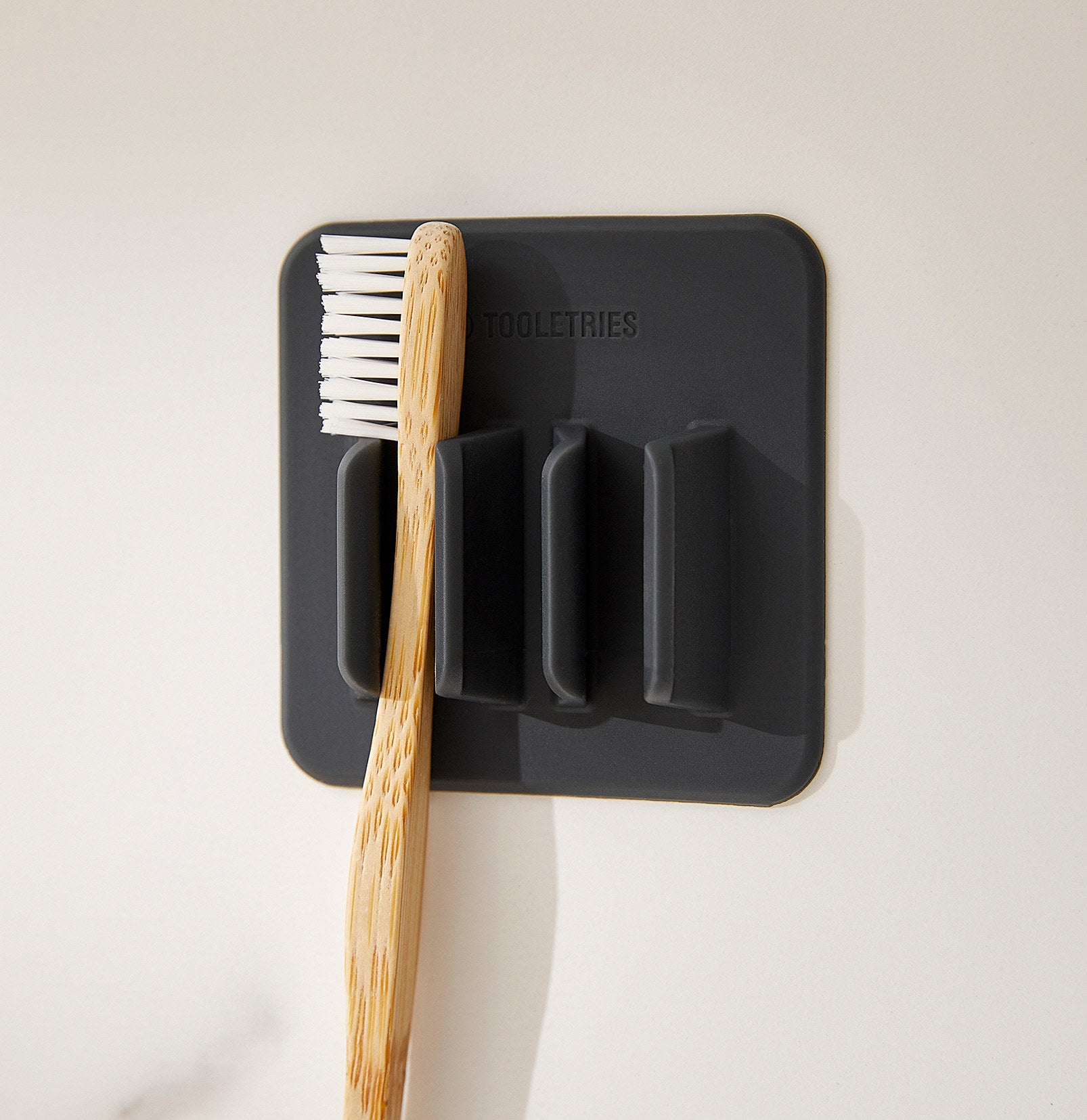 a toothbrush mounted into the silicone holder