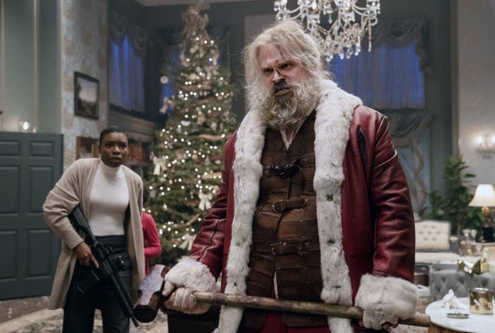 A bloodied Santa holds a sledgehammer