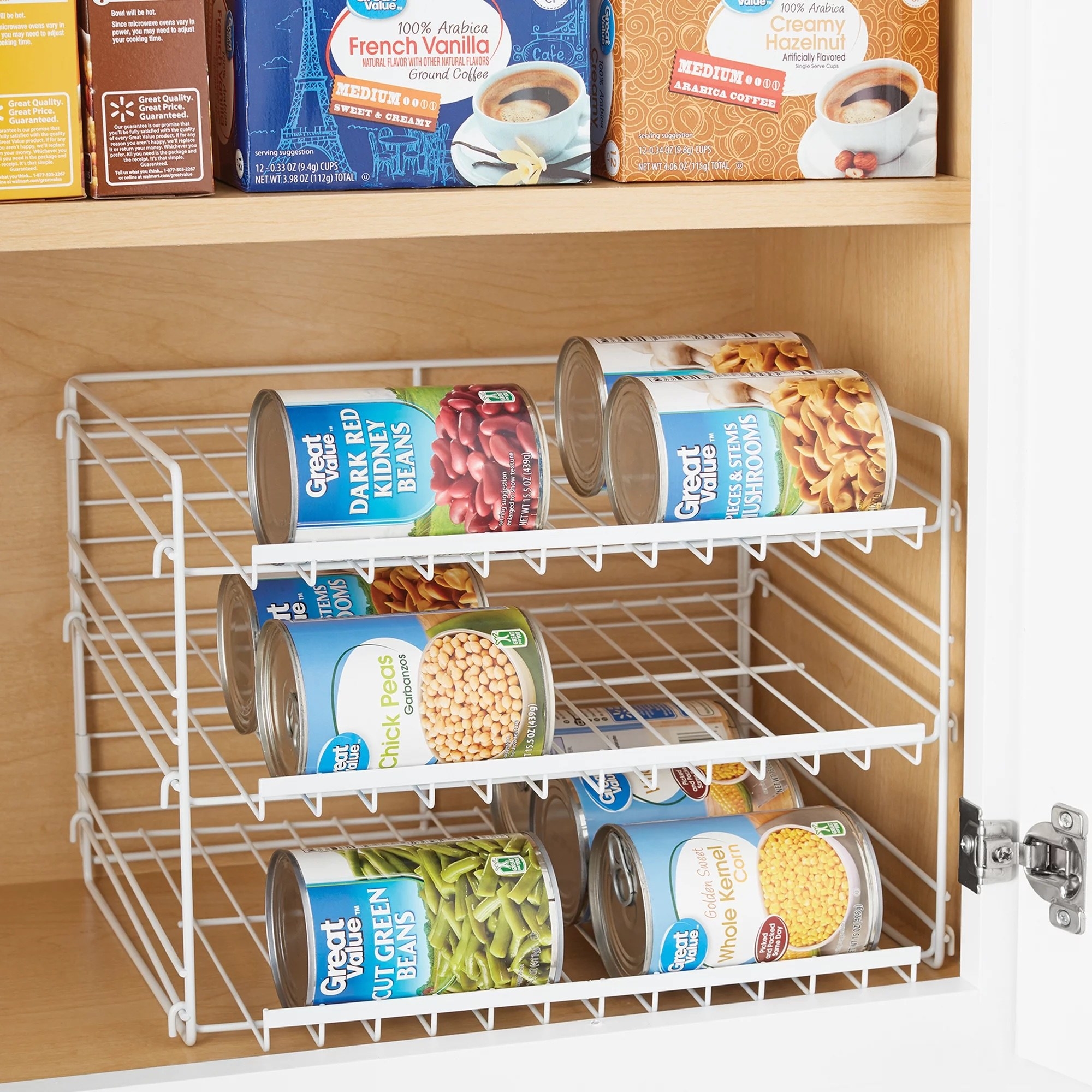 a white three-tier organizer rack holding canned goods