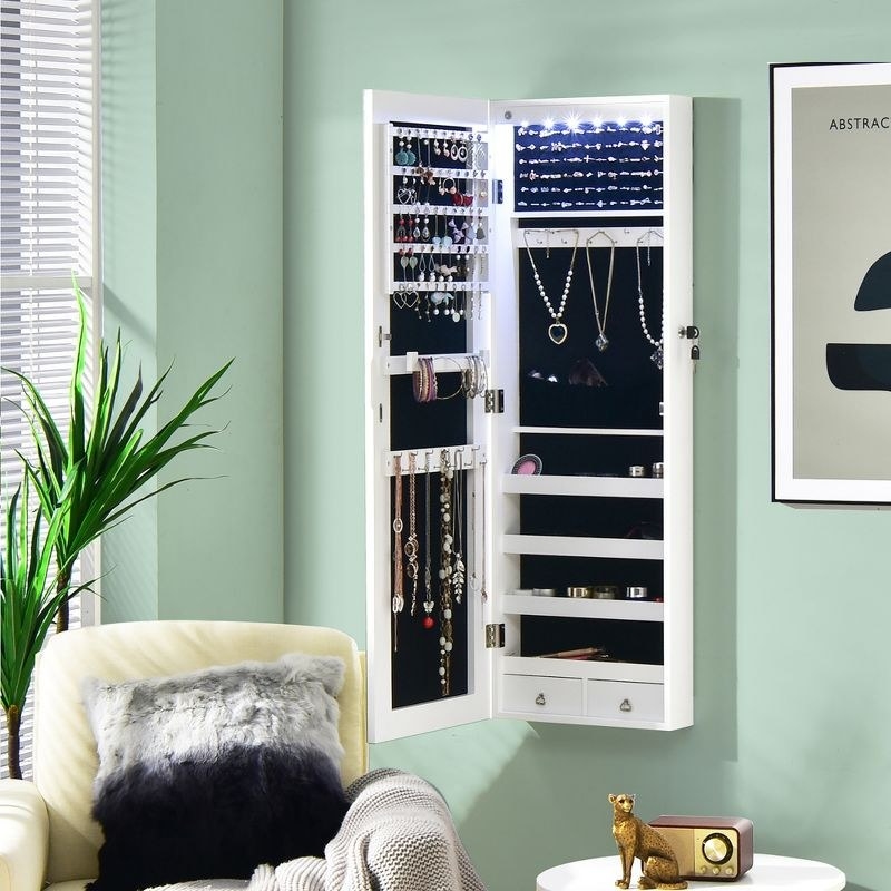 Jewelry cabinet hanging on bedroom wall