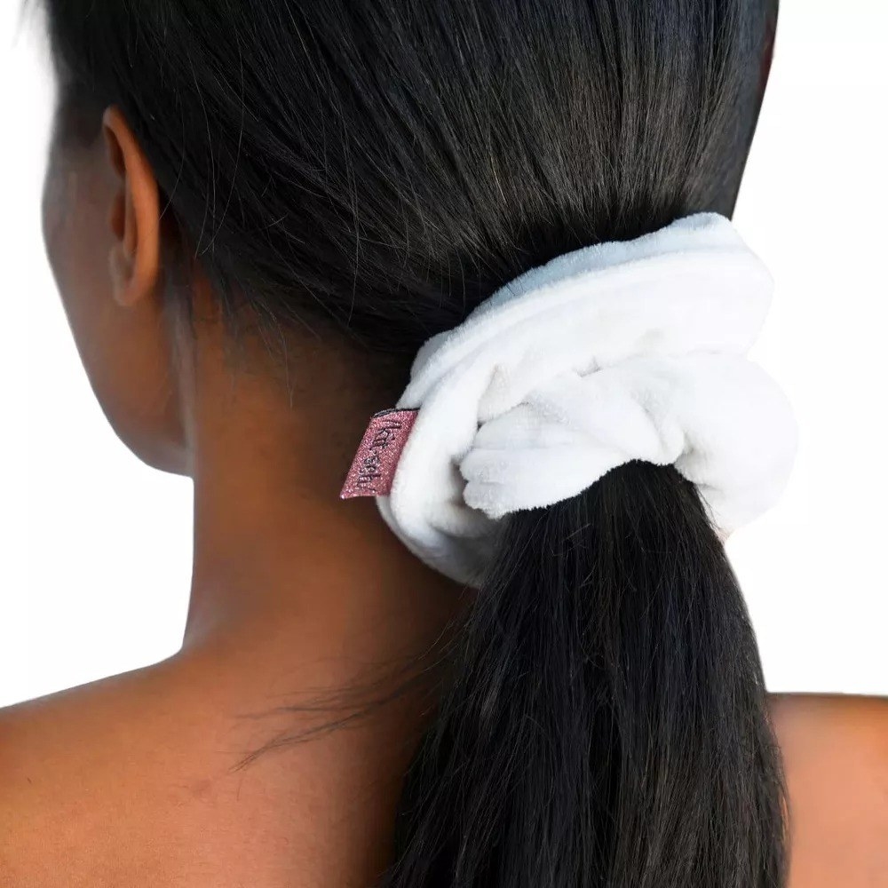 a model wearing the white scrunchie
