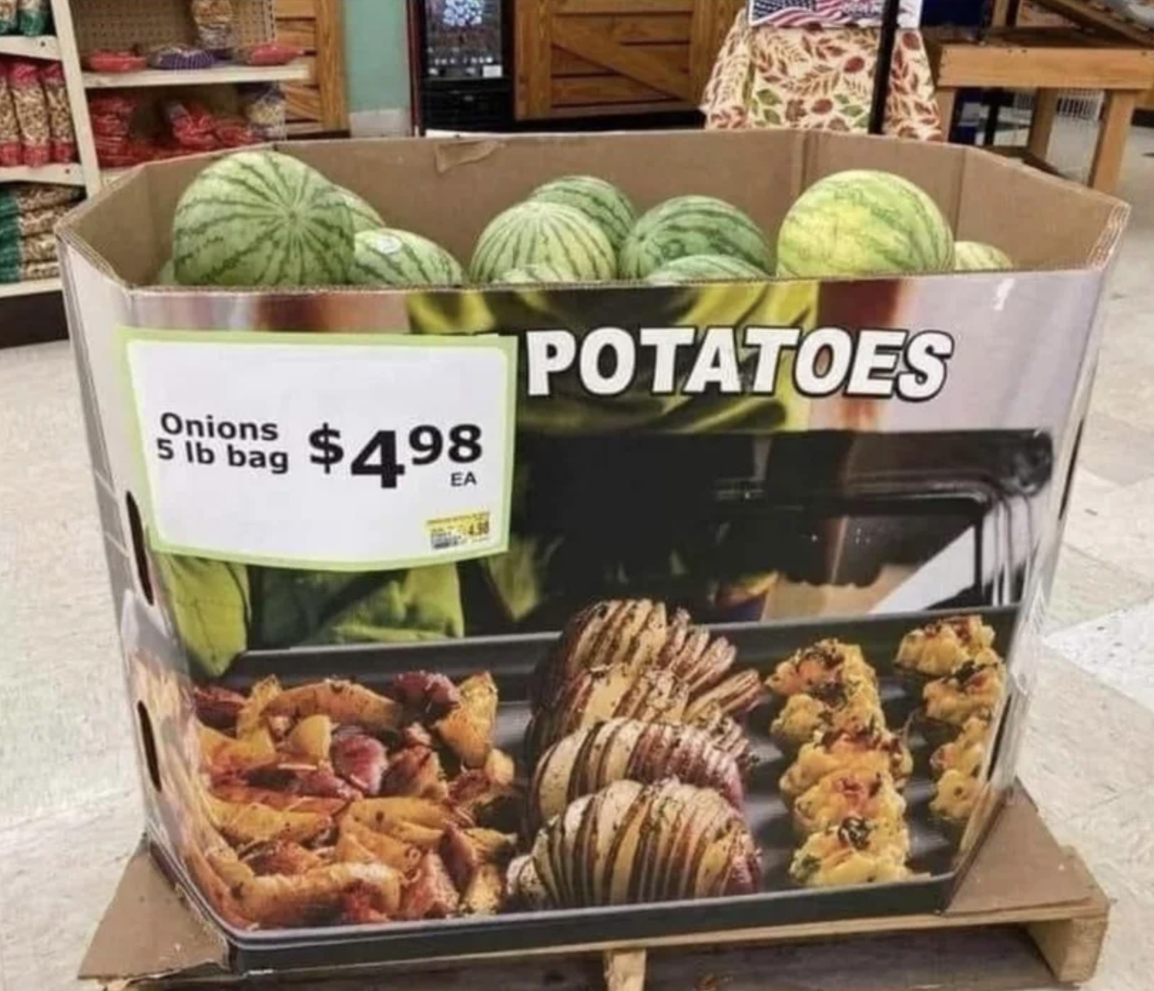Bin with &quot;Onions: 5 lb bag $5 each&quot; and &quot;Potatoes&quot; written on it, with whole watermelons in it