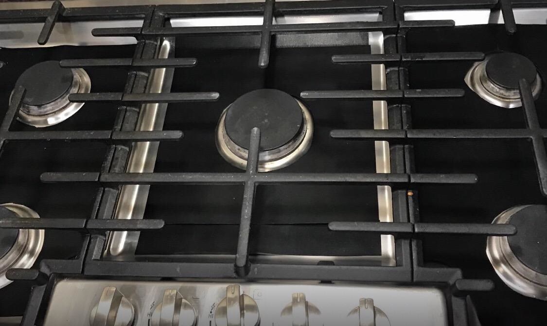 the burner covers installed on a gas oven range