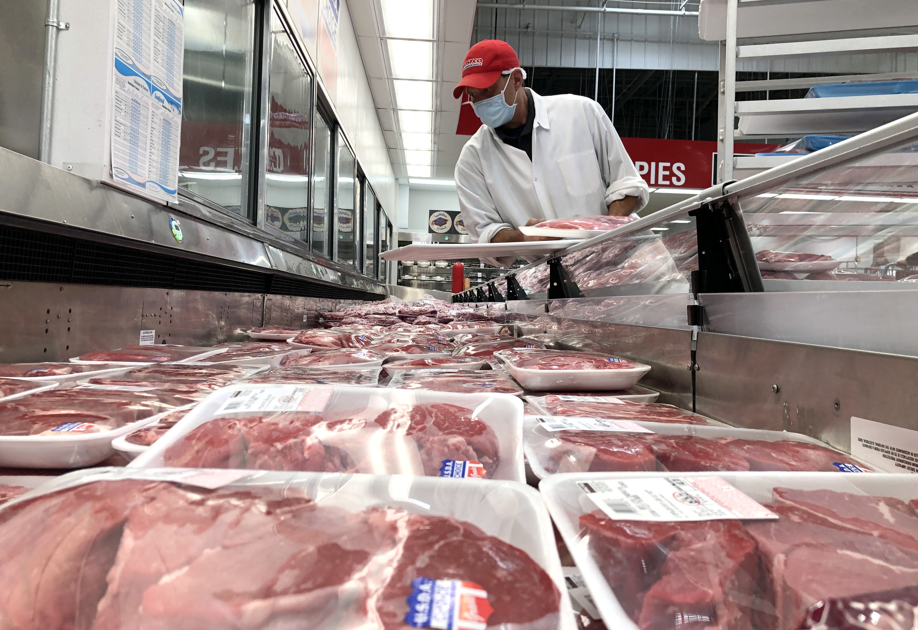 large chest refrigerator of various beef cuts at costco