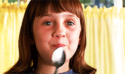 closeup of matilda smiling with a spoon in hand