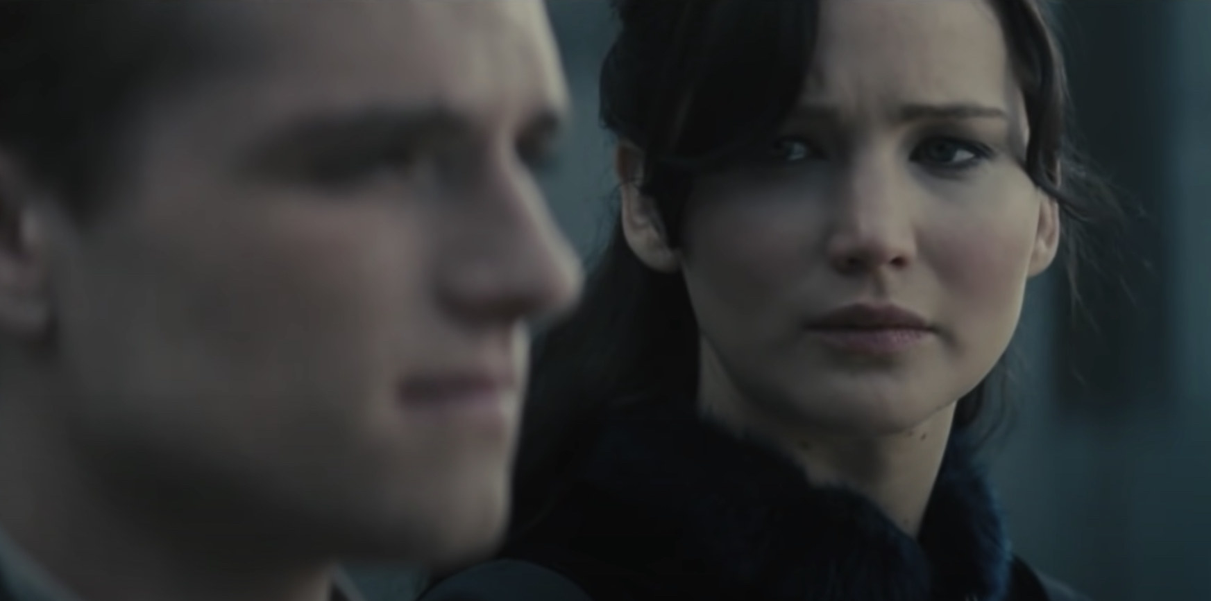Katniss looking at Peeta while he speaks