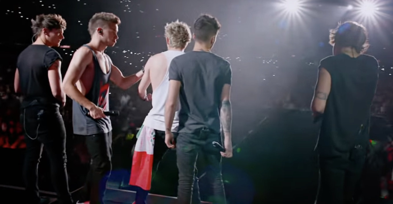 The One Direction boys on stage during a concert