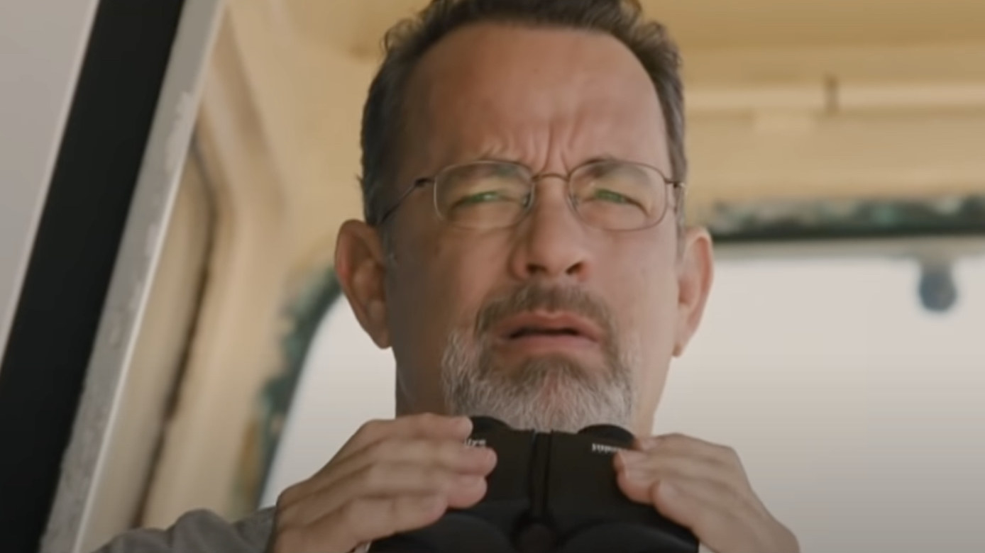 Captain Phillips holding binoculars