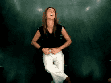 celine spinning in a chair for her music video
