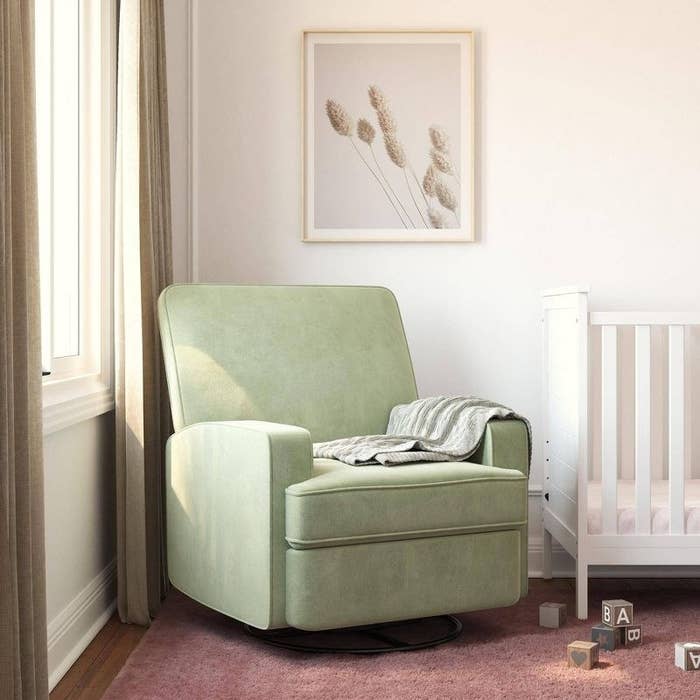 Sage green chair in nursery