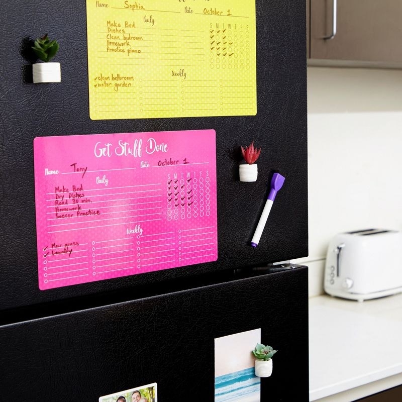 Chore chart hanging on refrigerator