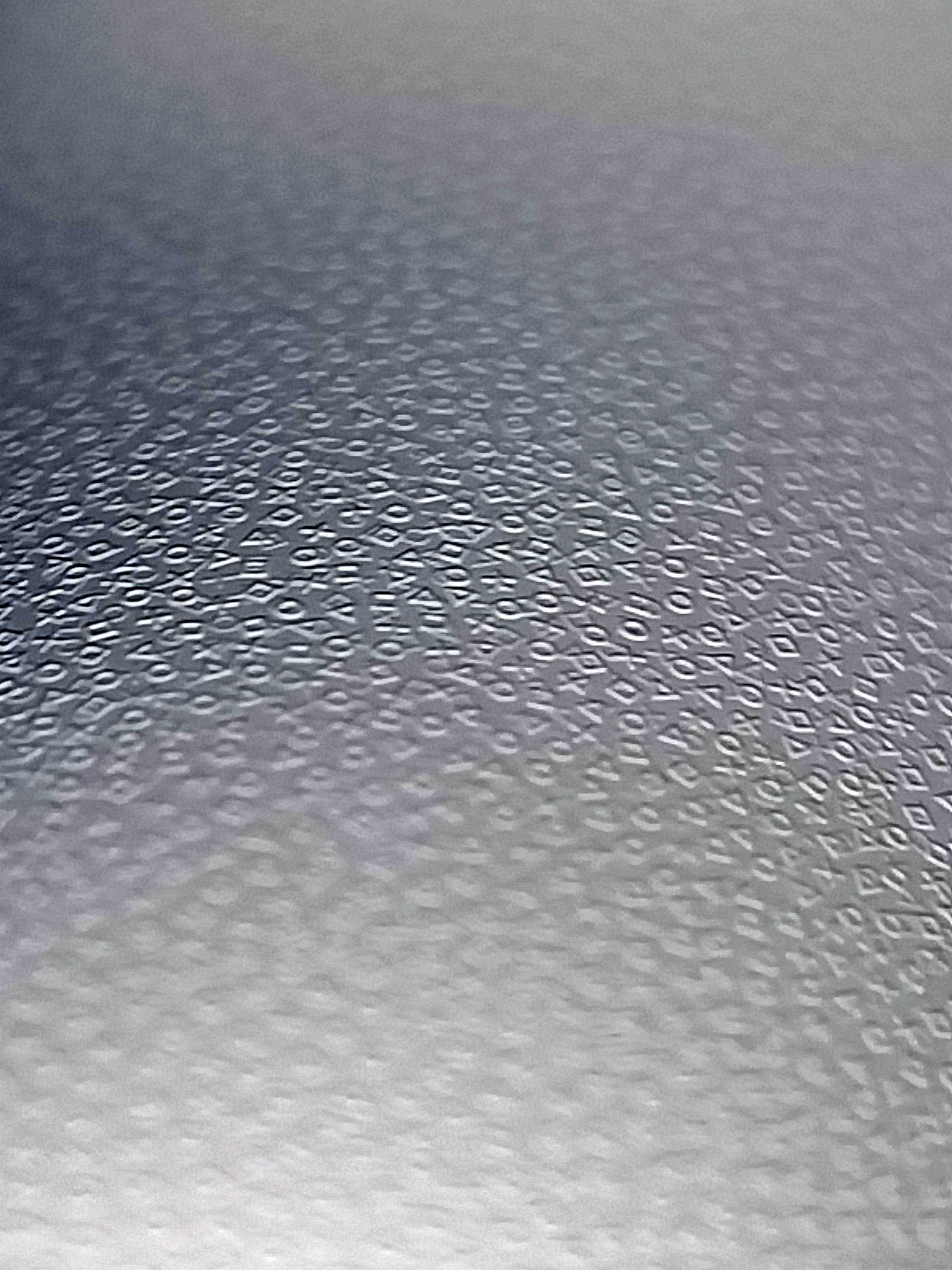 Close-up of surface with a mass of symbols