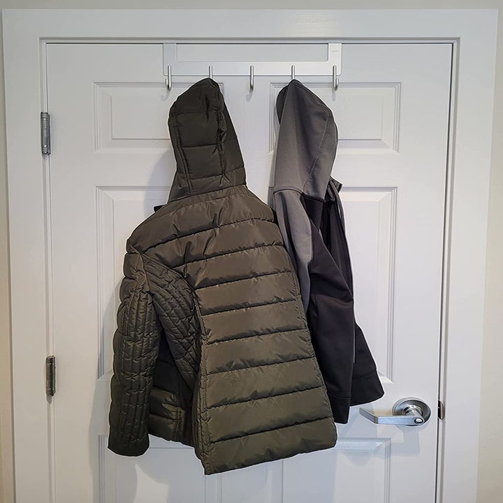 Reviewer's coats are shown on the hooks