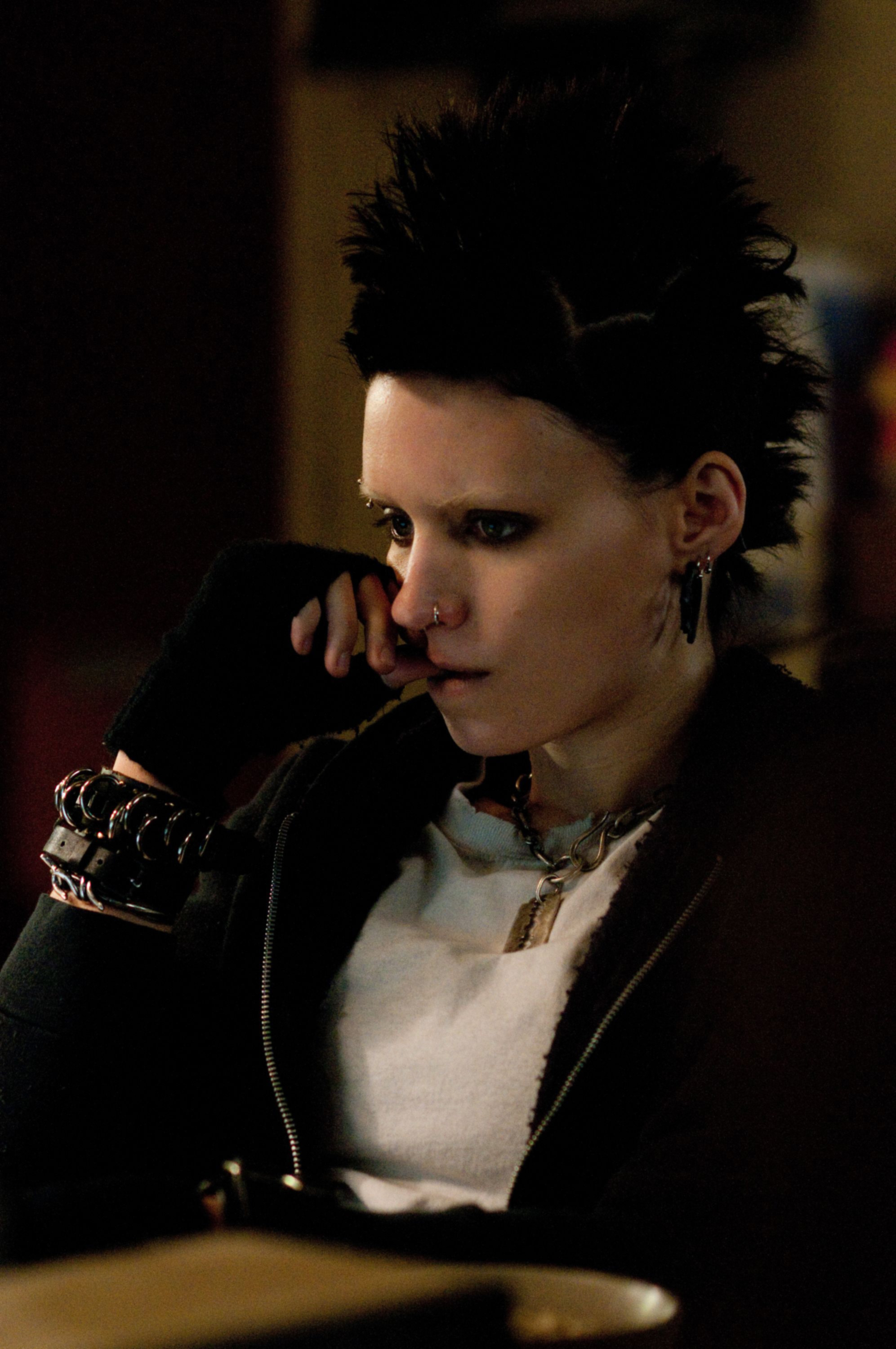 A contemplative Rooney sitting in a scene from Girl with a Dragon tattoo