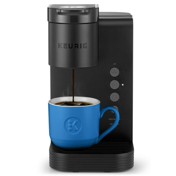 the black keurig brewing coffee in a mug