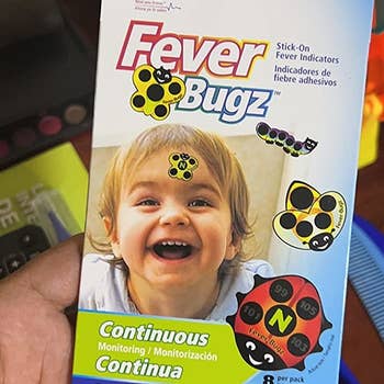 Reviewer holding the pack of fever indicator stickers