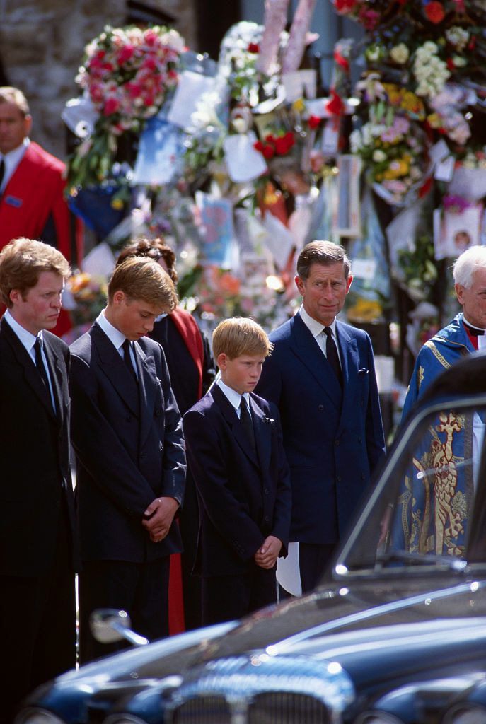 The boys, their father, and their Uncle Charles Spencer watch as Princess Diana&#x27;s hearse goes by