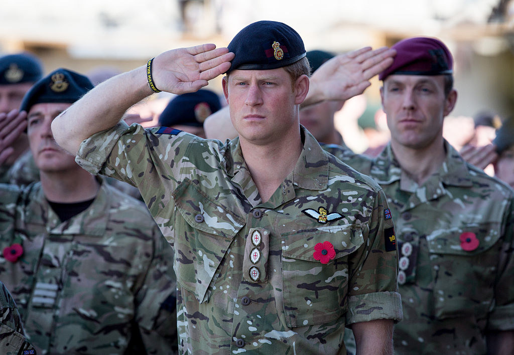 Harry saluting along with other soldiers in formation