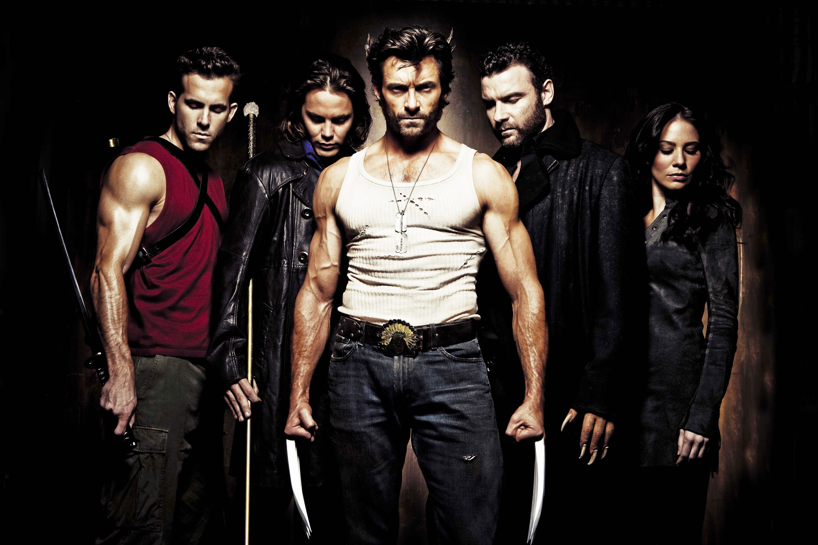 Wolverine stands in the middle of a group of his costars