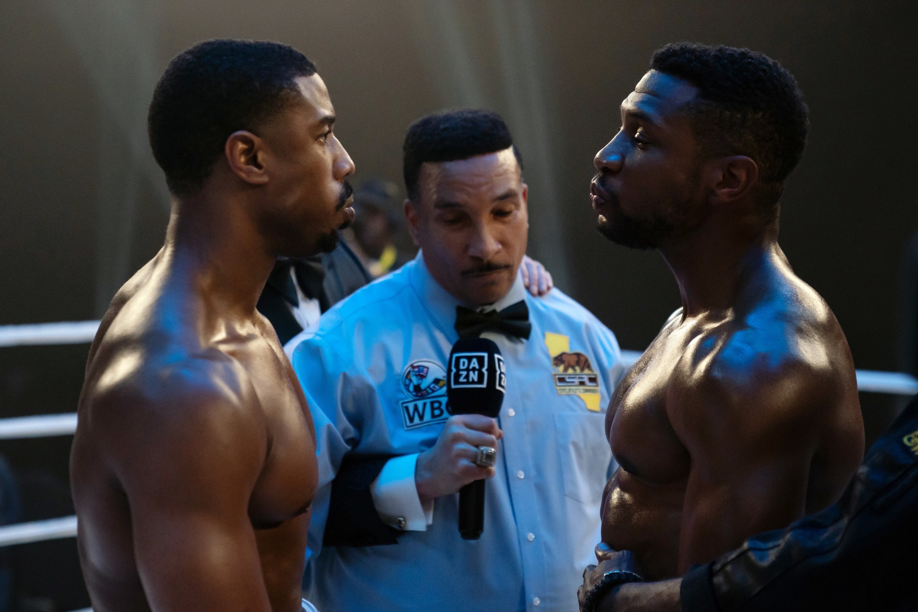 Two men face each other, about to box