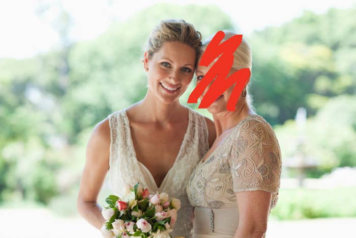 A bride posing with a woman whose face is scratched out