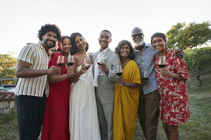 People at a wedding holding wine glasses