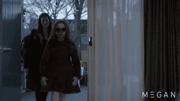 M3gan entering a house and taking off her sunglasses like a badass