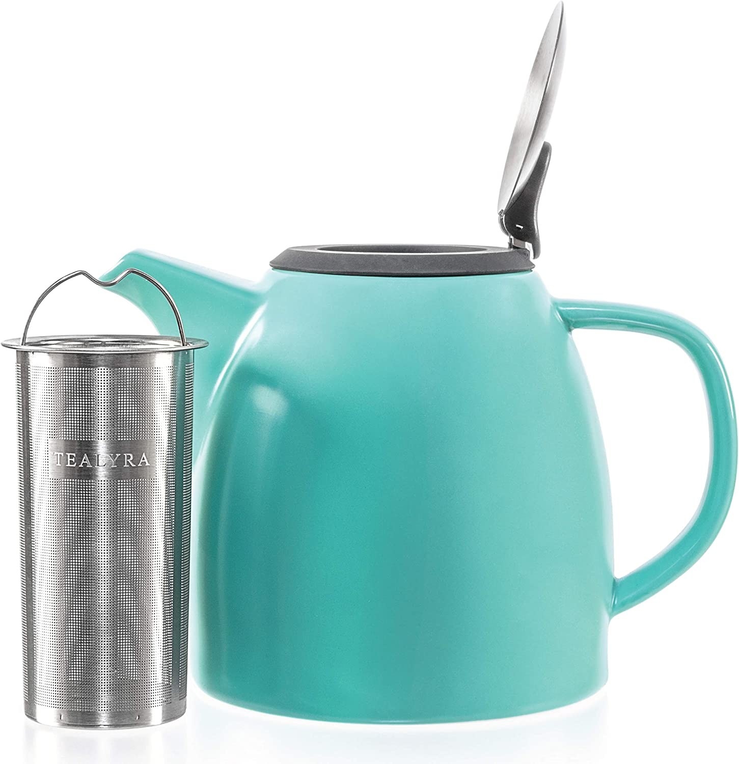 a cute tea pot and a long mesh tea infuser against a blank background