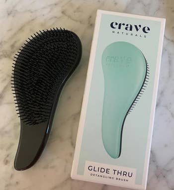 a reviewer photo of the brush and the box it comes in