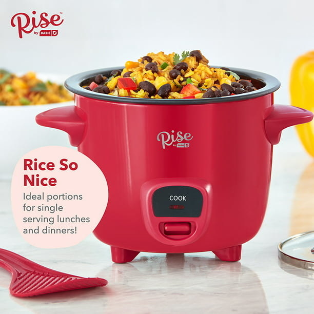 the rice cooker in red with rice inside