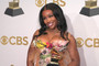 SZA holds her Grammy award for  Best Pop Duo Group Performance Award