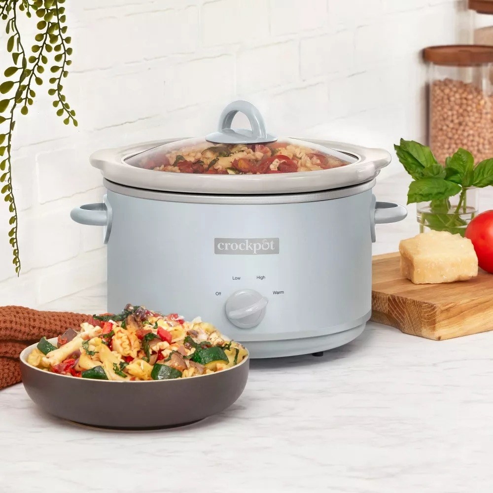The Crock Pot warming food on a kitchen counter