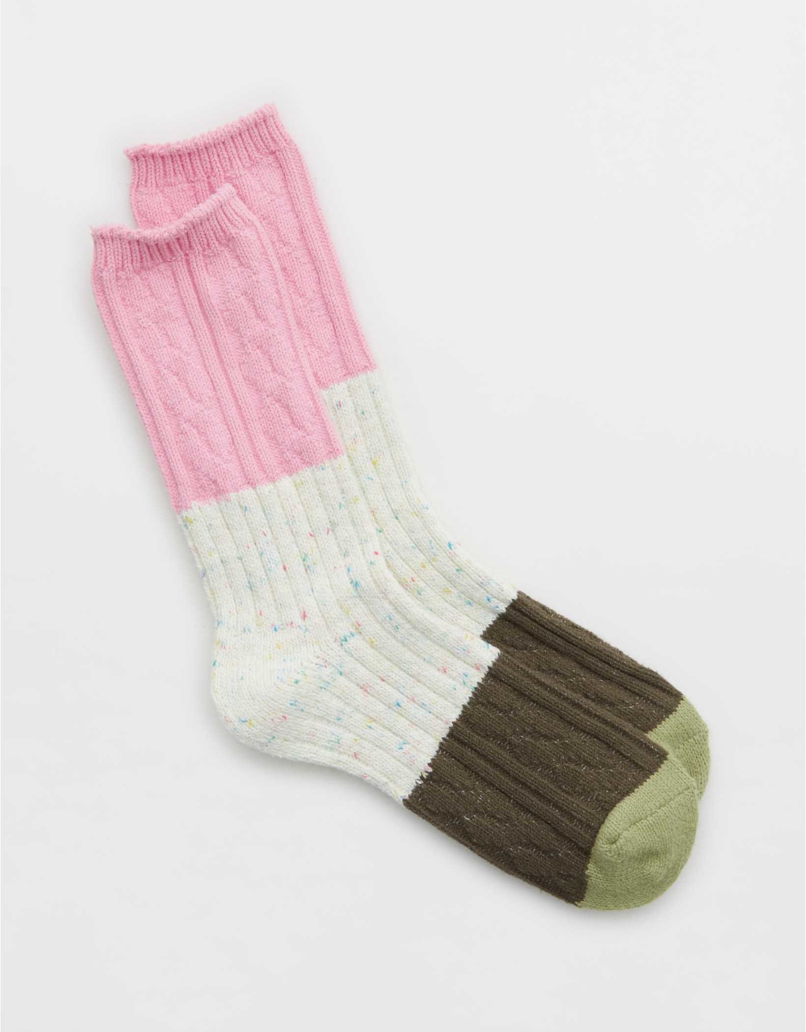 ribbed crew socks with green toes, olive heels, confetti speckled white middles, and pink tops