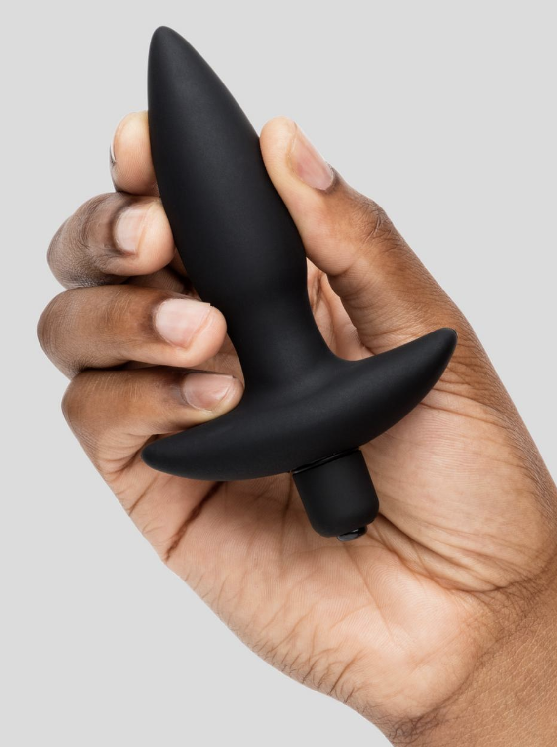 person holding the butt plug