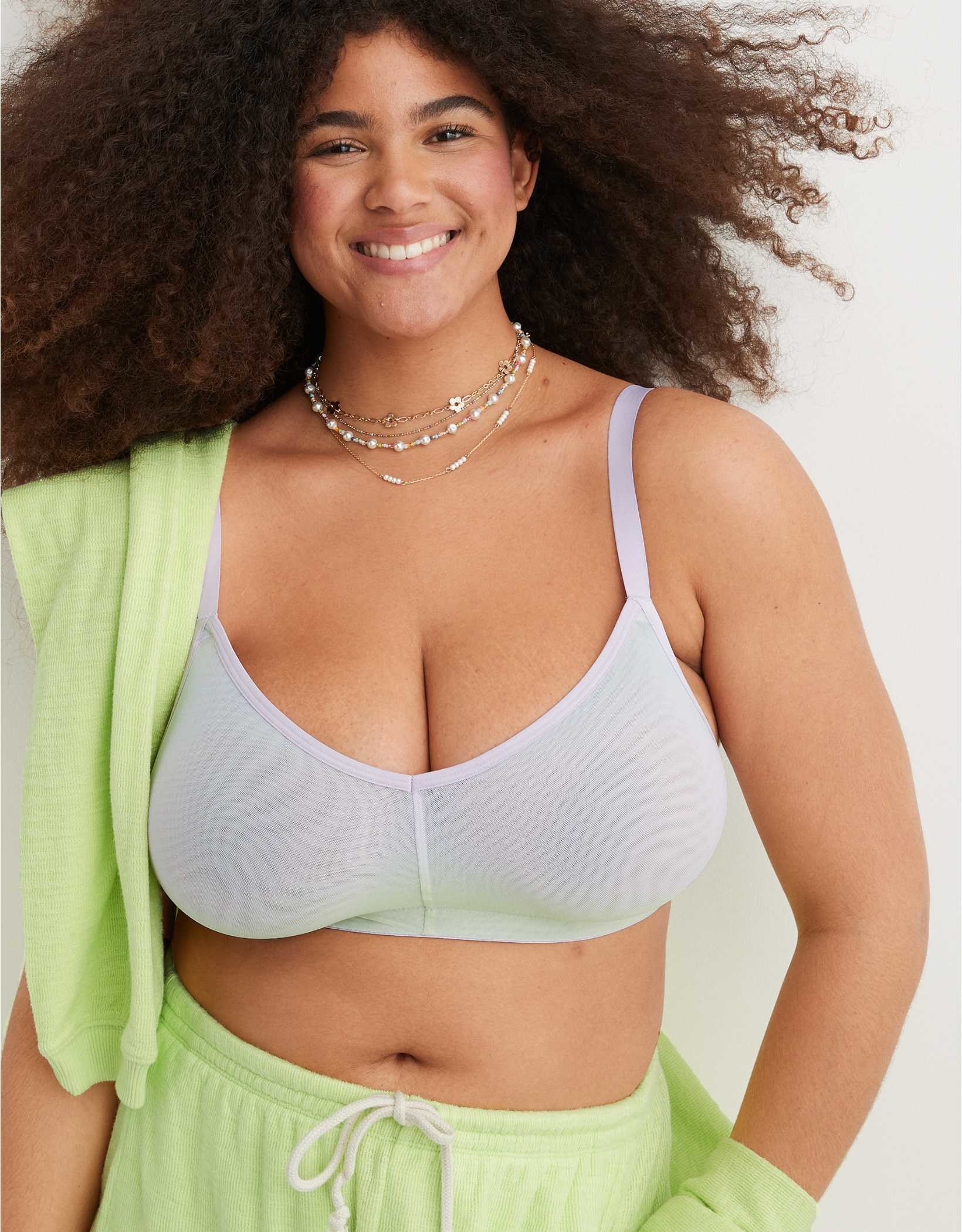 model in mesh bralette that fades from lilac to lime green
