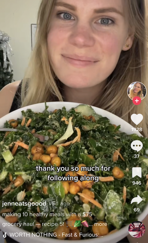 a woman posing with a bowl of vegetables