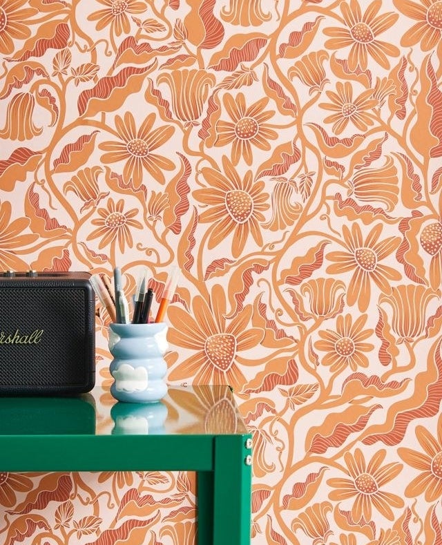 decorative floral wallpaper in front of a vibrant desk