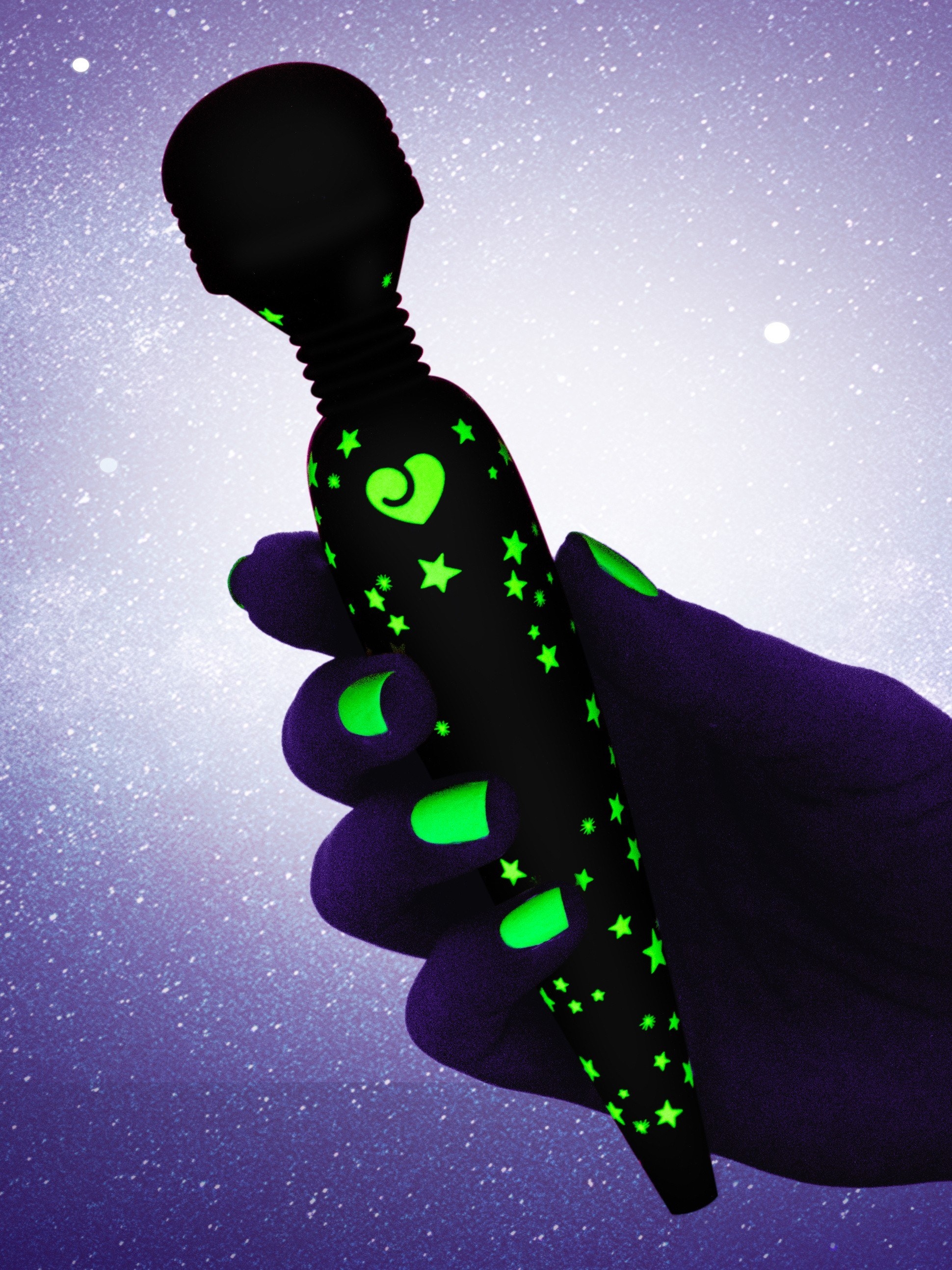 person holding the wand with the stars glowing