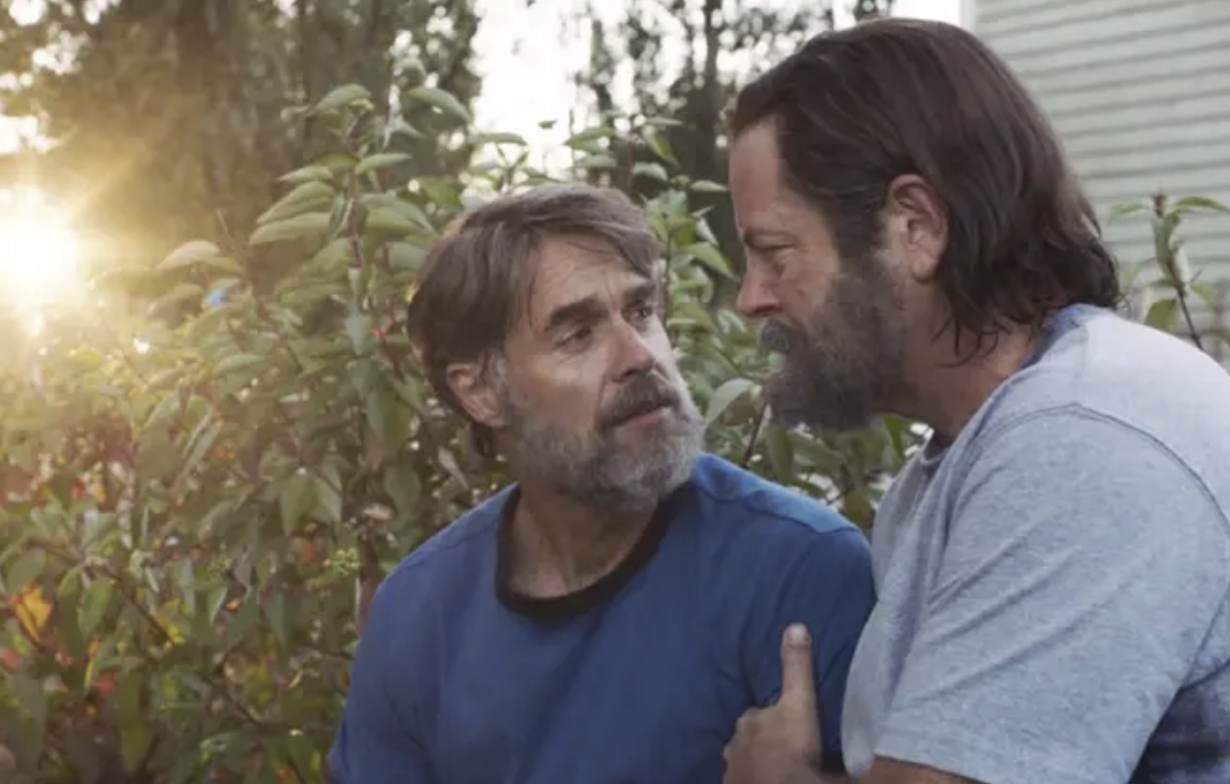 Bill and Frank look into each other&#x27;s eyes as they kneel in the garden