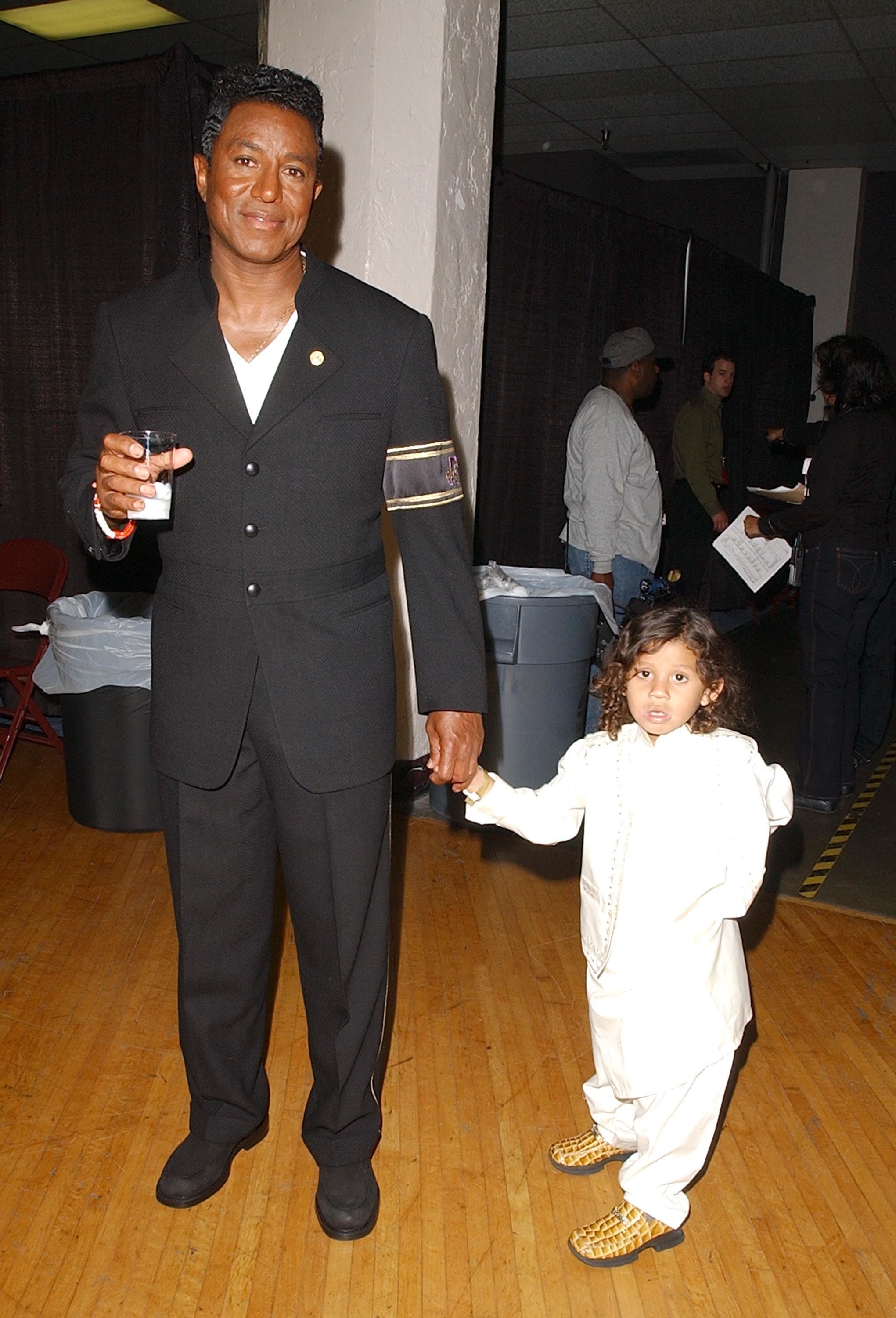 Jermaine Jackson holding son Jermajesty&#x27;s hand