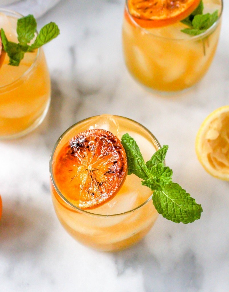 Clementine cocktails garnished with citrus and mint